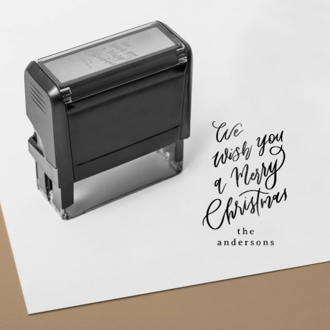 Wir wünschen Ihnen ein frohes Weihnachtsgeschenk Permastempel (self inking stamp with a hand lettering Merry Christmas message and custom family name)