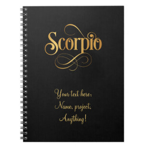 Wirbles Script Zodiac Sign Scorpio Gold auf schwar Notizblock