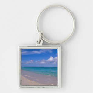 Wolke im blauen Himmel über sandigem Strand Schlüsselanhänger