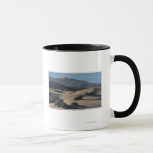 Wüsten-Sanddünen und Schnee-Mit einer Kappe Tasse