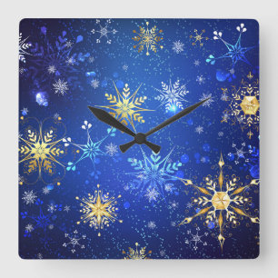 XMAS Blue Background mit goldenen Schneeflocken Quadratische Wanduhr