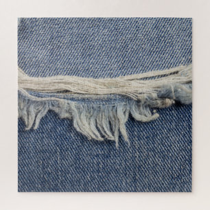 Zerrissene Jeans-Textur, stilvoller Hintergrund.