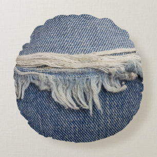 Zerrissene Jeans-Textur, stilvoller Hintergrund. Rundes Kissen