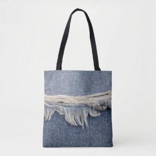 Zerrissene Jeans-Textur, stilvoller Hintergrund. Tasche