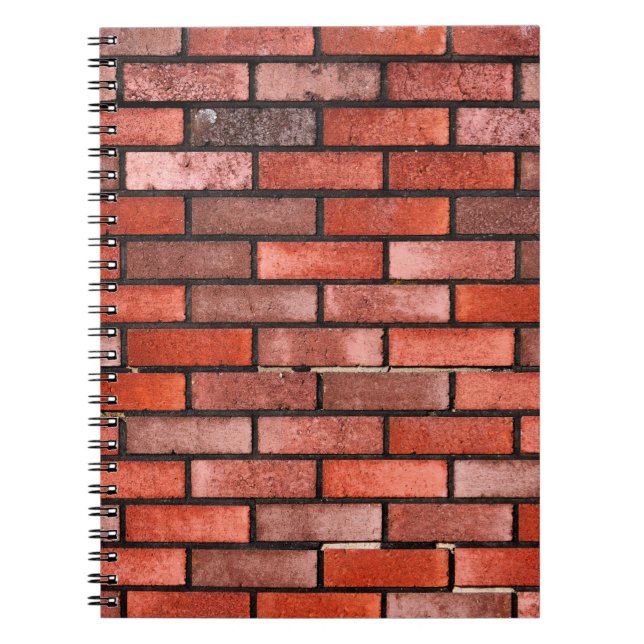 Ziegelmauer mit rotem Backstein, roter Backstein.  Notizblock (Vorderseite)