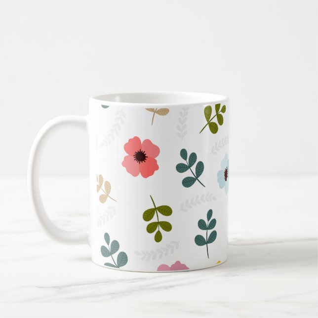 Ziemlich verschiedene farbige Blumen und grünes La Kaffeetasse (Links)