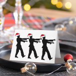 Zombie Santa Christmas Feiertagskarte<br><div class="desc">Zombies in roten Weihnachtsmannmützen,  die in einer Linie laufen und vor ihnen ausgestreckte Totenarme. Ein phantastisches Urlaubsgeschenk für einen Horror-Fan.</div>