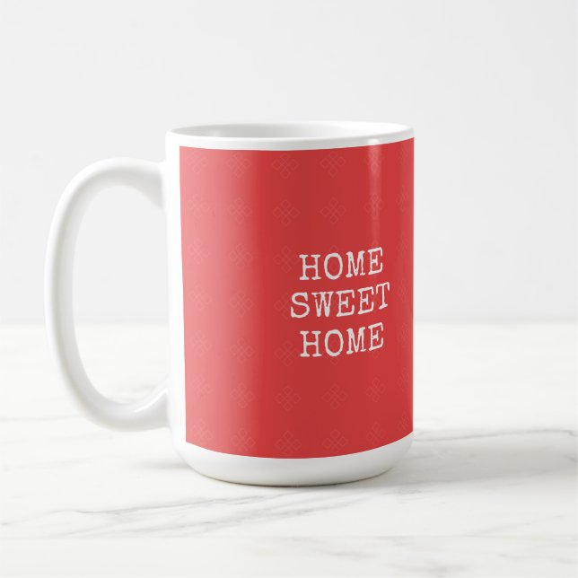 Zuhause-Zuhause-Text in orangefarbenem Rosa Kaffeetasse (Links)