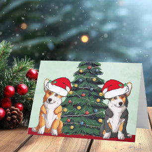 Zwei Corgi-Weihnachtsbaum-Hund-Santa-Hut Cute Feiertagskarte