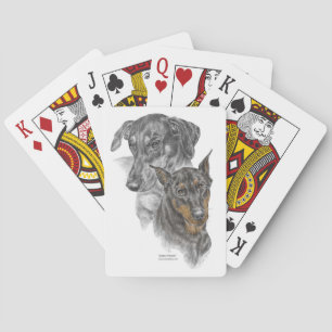 Zwei Doberman Pinscher Hunde spielen Karten Spielkarten