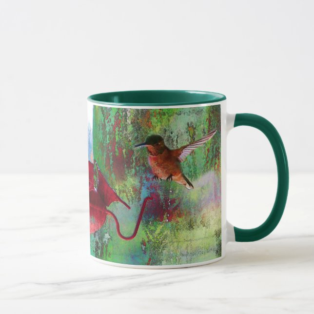Zwei farbenfrohe Schwebvögel am Züchter Tasse (Rechts)