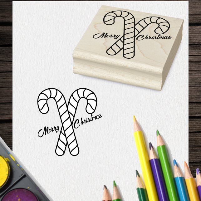 Zwei frohe Weihnachten Crossed Candy Cane Kontur Gummistempel (Two crossed striped candy canes with Merry Christmas on craft rubber holiday stamp.)