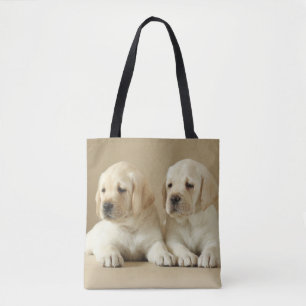Zwei Golden Labrador Welpen Tasche