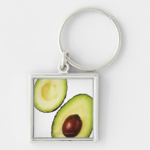Zwei Hälften von eine Avocado, auf Weiß Schlüsselanhänger