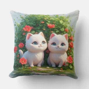 Zwei niedliche Katzen sitzen in einem lebendigen W Kissen