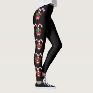 Zwei rote und weiße festliche Zuckerrohre auf Schw Leggings