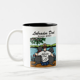 Zwei schwarzes Labradors und Vater Zweifarbige Tasse