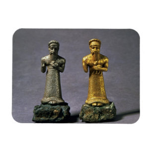 Zwei Statuetten der Männer, die Angebote der Magnet