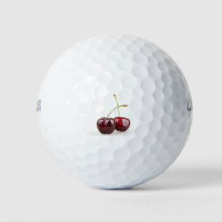 Zwei süße Kirschfrüchte abgeschieden auf weißem Hi Golfball