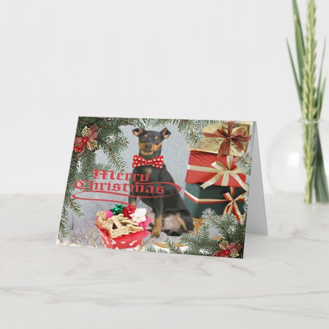 Zwergpinscher holt Weihnachtsgrüße Feiertagskarte (Vorderseite)